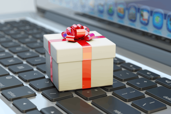 white_present_with_red_ribbon_on_laptop_keyboard-1200x800.min_.png